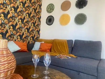 Coin salon dans l'établissement Gite de la rivière avec patio et parking centre ville