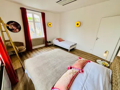 Un ou plusieurs lits dans un hébergement de l'établissement Hypercentre, spacieux, lumineux, climatisé, le Quai de Loire