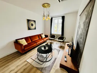 Coin salon dans l'établissement Hypercentre, spacieux, lumineux, climatisé, le Quai de Loire