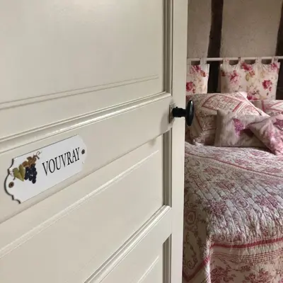 Un ou plusieurs lits dans un hébergement de l'établissement Cottage du vigneron