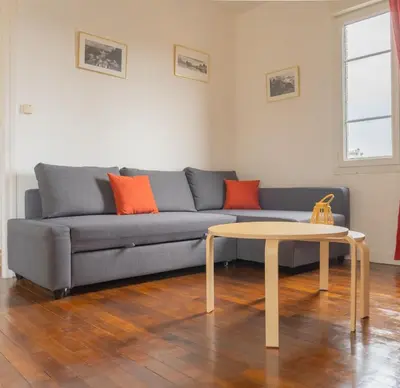 Coin salon dans l'établissement Appartement Cosy avec garage privé