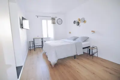 Un ou plusieurs lits dans un hébergement de l'établissement Studios Lsquare-Residence
