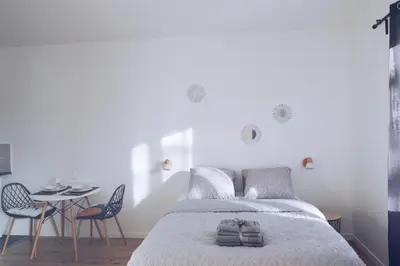 Un ou plusieurs lits dans un hébergement de l'établissement Studios Lsquare-Residence