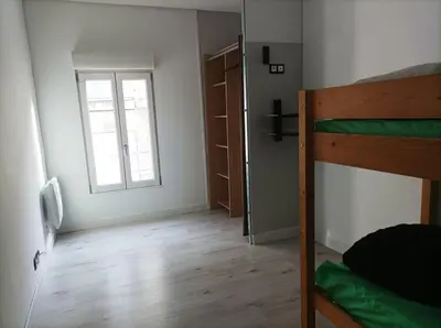Un ou plusieurs lits dans un hébergement de l'établissement Agréable maison de ville tout confort