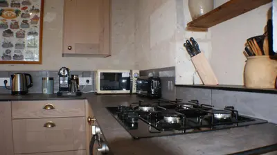 Cuisine ou kitchenette dans l'établissement Le Guet de Chouette
