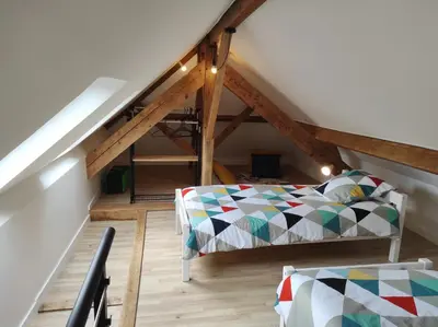 Un ou plusieurs lits dans un hébergement de l'établissement duplex appartement 70m2 atypique au cœur du Mans