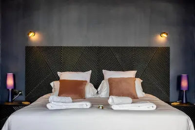 Un ou plusieurs lits dans un hébergement de l'établissement Casa Mila Loire - L'expérience Hôtel & Spa - Angers Saumur