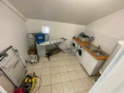 Cuisine ou kitchenette dans l'établissement Aux Premières Loges - Gîte de charme proche du circuit