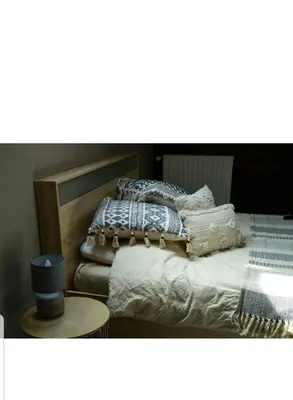 Un ou plusieurs lits dans un hébergement de l'établissement Agréable chambre privée avec entrée indépendante