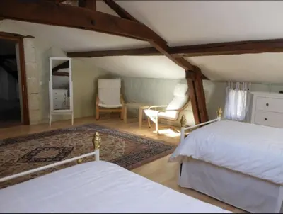 Un ou plusieurs lits dans un hébergement de l'établissement Closerie Les Roches - Charming and spacious 2 bedroom cottage