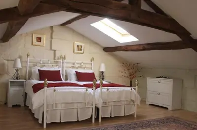 Un ou plusieurs lits dans un hébergement de l'établissement Closerie Les Roches - Charming and spacious 2 bedroom cottage