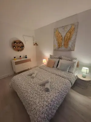 Un ou plusieurs lits dans un hébergement de l'établissement Appartement zen et calme, centre ville