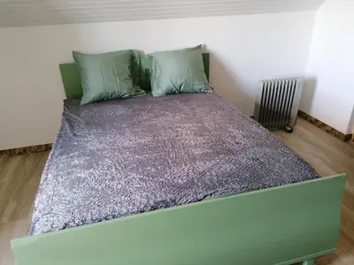 Un ou plusieurs lits dans un hébergement de l'établissement Chambre parentale chez l'habitant