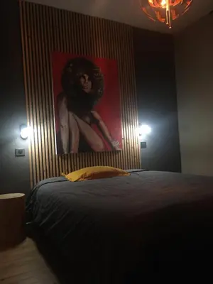 Un ou plusieurs lits dans un hébergement de l'établissement Maison cosy à 2km du circuit bugatti des 24h