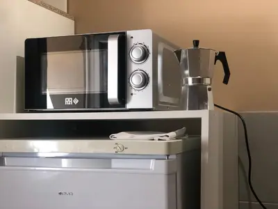 Cuisine ou kitchenette dans l'établissement Appart-Studio Daniella