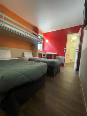 Un ou plusieurs lits dans un hébergement de l'établissement PREMIERE CLASSE ANGERS SUD Louvre Hotels group