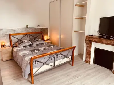 Un ou plusieurs lits dans un hébergement de l'établissement Superbe appartement à la croisée des 4 Châteaux