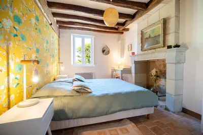 Un ou plusieurs lits dans un hébergement de l'établissement Le Clos Eugenie - Charmante maison avec jardin et vue sur la Loire