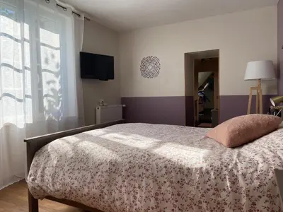 Un ou plusieurs lits dans un hébergement de l'établissement Les chambres de l'atelier