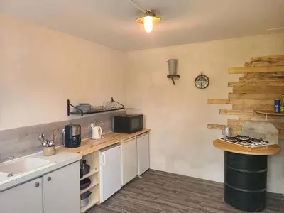 Cuisine ou kitchenette dans l'établissement Les roulottes du Moulin de Palet