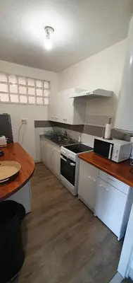 Cuisine ou kitchenette dans l'établissement Beau T2 en centre ville avec place de parking auto vélo