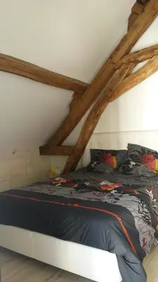 Un ou plusieurs lits dans un hébergement de l'établissement Gîte Dodo Lé La