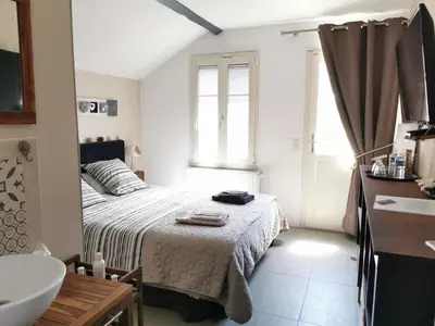 Un ou plusieurs lits dans un hébergement de l'établissement Chambres d'hôtes L'Escale Charmante