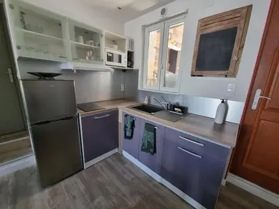 Cuisine ou kitchenette dans l'établissement Joli appart. 2 à 8 pers. a 20 min du futuroscope