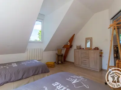 Un ou plusieurs lits dans un hébergement de l'établissement Gîte accueillant avec piscine chauffée à partager, près d'Angers, idéal pour vacances en nature - FR-1-622-44