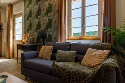 Coin salon dans l'établissement Maison avec balnéo à 10min du Zoo de Beauval