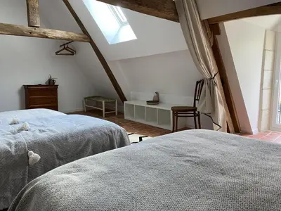 Un ou plusieurs lits dans un hébergement de l'établissement Gîte de charme 