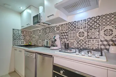 Cuisine ou kitchenette dans l'établissement Le Petit Prateau - à 800m du Zoo