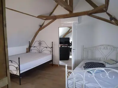 Un ou plusieurs lits dans un hébergement de l'établissement Le Manoir à proximité de Tours