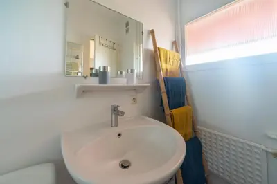 Salle de bains dans l'établissement Le Merel