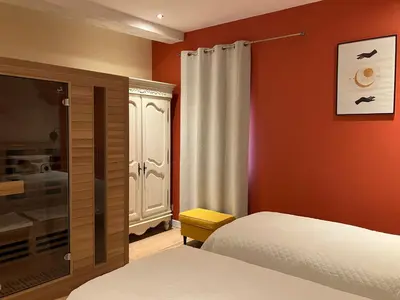 Un ou plusieurs lits dans un hébergement de l'établissement Le Manoir des Sables - Hébergement familial grand confort