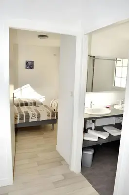 Un ou plusieurs lits dans un hébergement de l'établissement Grande maison accueillante à Saint-Épain avec salle de réception