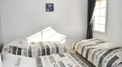 Un ou plusieurs lits dans un hébergement de l'établissement Grande maison accueillante à Saint-Épain avec salle de réception