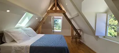 Un ou plusieurs lits dans un hébergement de l'établissement Le Bois Flotté - Maison au cœur de la Loire entre ville et nature