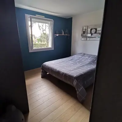 Un ou plusieurs lits dans un hébergement de l'établissement Appartement dans habitation privée avec piscine