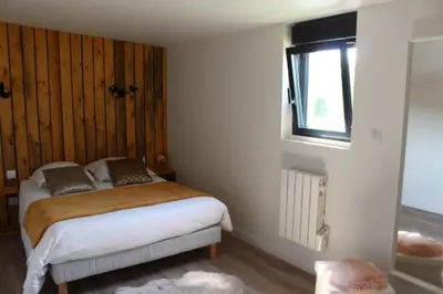 Un ou plusieurs lits dans un hébergement de l'établissement Chalet Vintage Les Belles Ouvrières