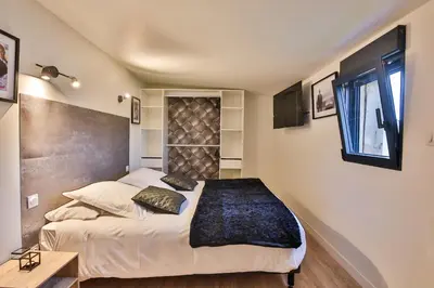 Un ou plusieurs lits dans un hébergement de l'établissement Chalet Cinema Les Belles Ouvrières