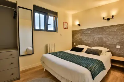 Un ou plusieurs lits dans un hébergement de l'établissement Chalet Cinema Les Belles Ouvrières