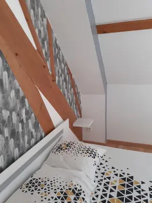 Un ou plusieurs lits dans un hébergement de l'établissement chambre chez habitant avec petit déjeuner