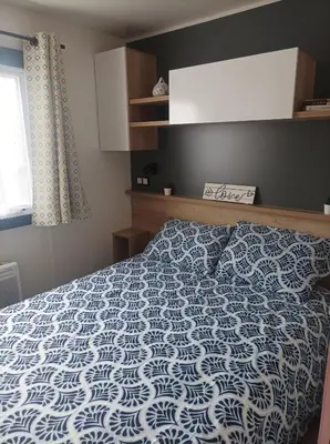 Un ou plusieurs lits dans un hébergement de l'établissement Mobil home Le Galland de Dugny