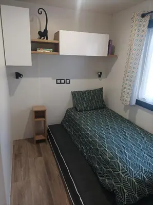 Un ou plusieurs lits dans un hébergement de l'établissement Mobil home Le Galland de Dugny