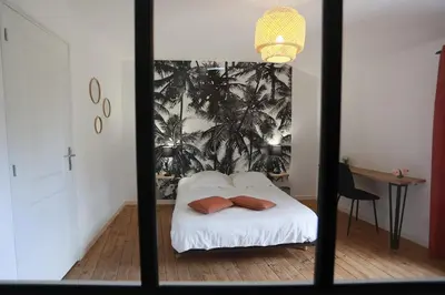 Un ou plusieurs lits dans un hébergement de l'établissement Maison Le Lodge- Centre Doué la Fontaine proche zoo