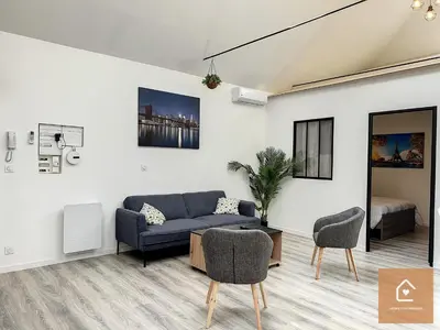 Coin salon dans l'établissement Le Loft Climatisé - 6 personnes - Entrée autonome