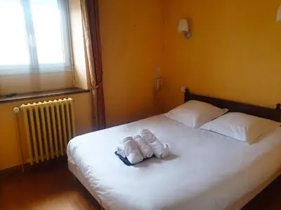 Un ou plusieurs lits dans un hébergement de l'établissement Coliwork Le Saint Romain
