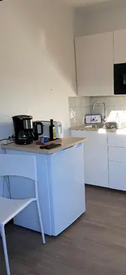 Cuisine ou kitchenette dans l'établissement Joli studio centre-ville Vendôme