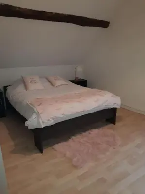 Un ou plusieurs lits dans un hébergement de l'établissement maison village 3 chambres 30 minutes du zoo de beauval